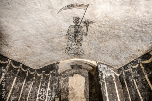 raffigurazione della Morte stilizzata con la falce in mano Cripta di San Sepolcro a Cagliari photo