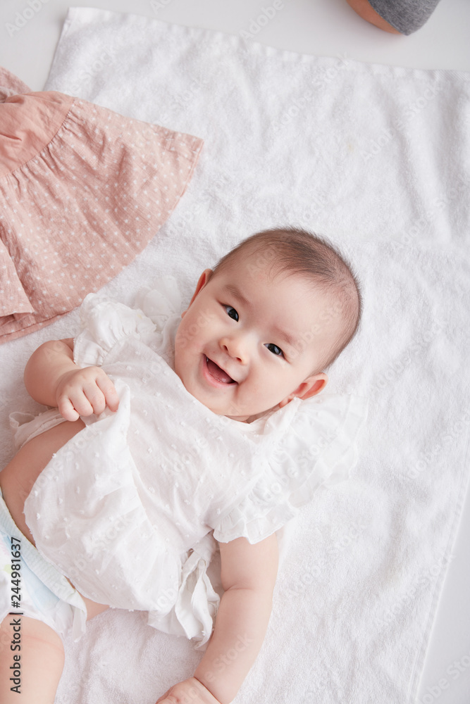 Asian cute baby photography in the studio,Shot from overhead on a white background. Asian cute baby photography in the studio,Shot from overhead on a white background.