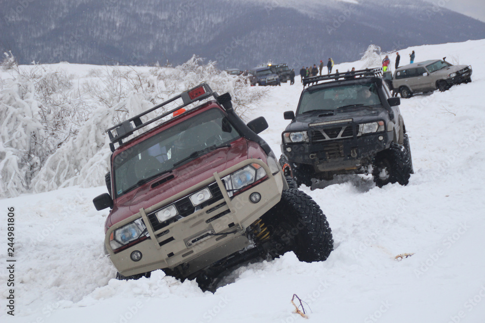 Winter offroad. Expedition to the top of the mountain. Snowy summits. Machines are stuck in the snow. Ukraine. Carpathian Winter offroad. Expedition to the top of the mountain. Snowy summits. Machines are stuck in the snow. Ukraine. Carpathian