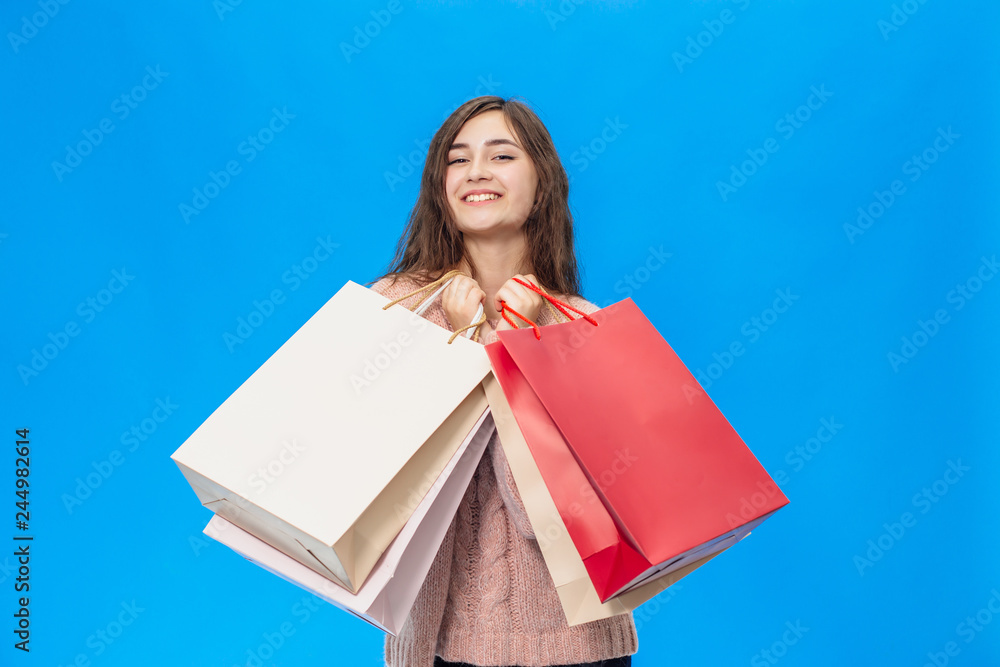 Young beautiful girl isolated on blue background Young beautiful girl isolated on blue background