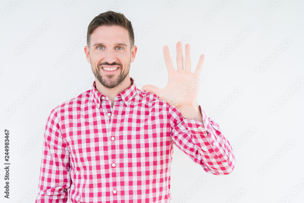 Young handsome man wearing shirt over isolated background showing and pointing up with fingers number five while smiling confident and happy. Young handsome man wearing shirt over isolated background showing and pointing up with fingers number five while smiling confident and happy.