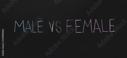 Words Male vs Female written on chalkboard