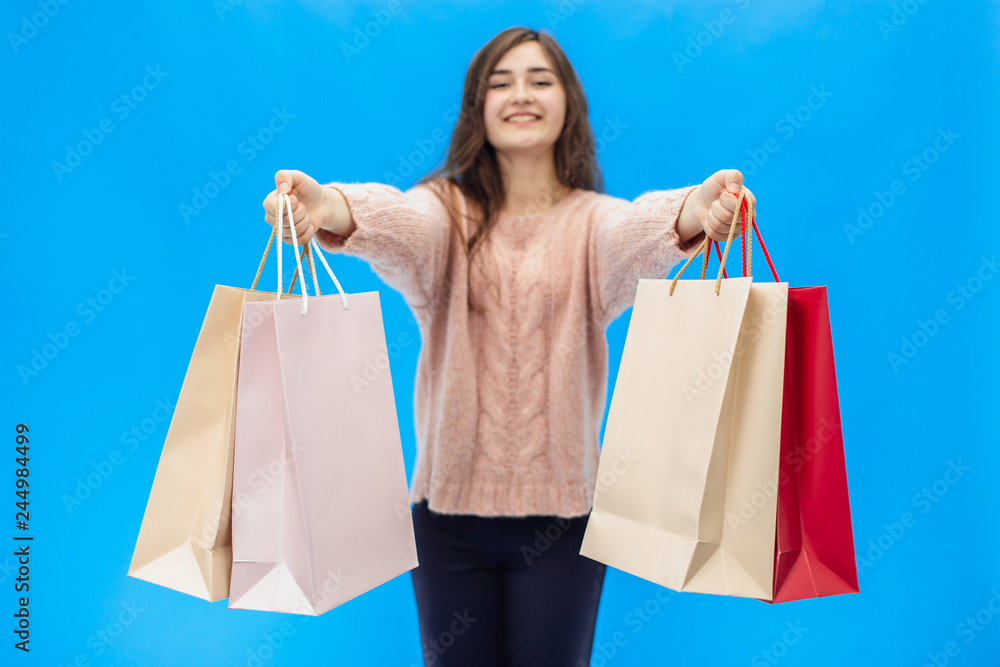 Young beautiful girl isolated on blue background Young beautiful girl isolated on blue background