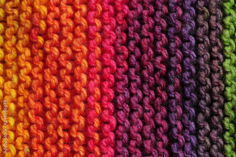 Rows of seamless knitted patterns in vivid rainbow mix of colors