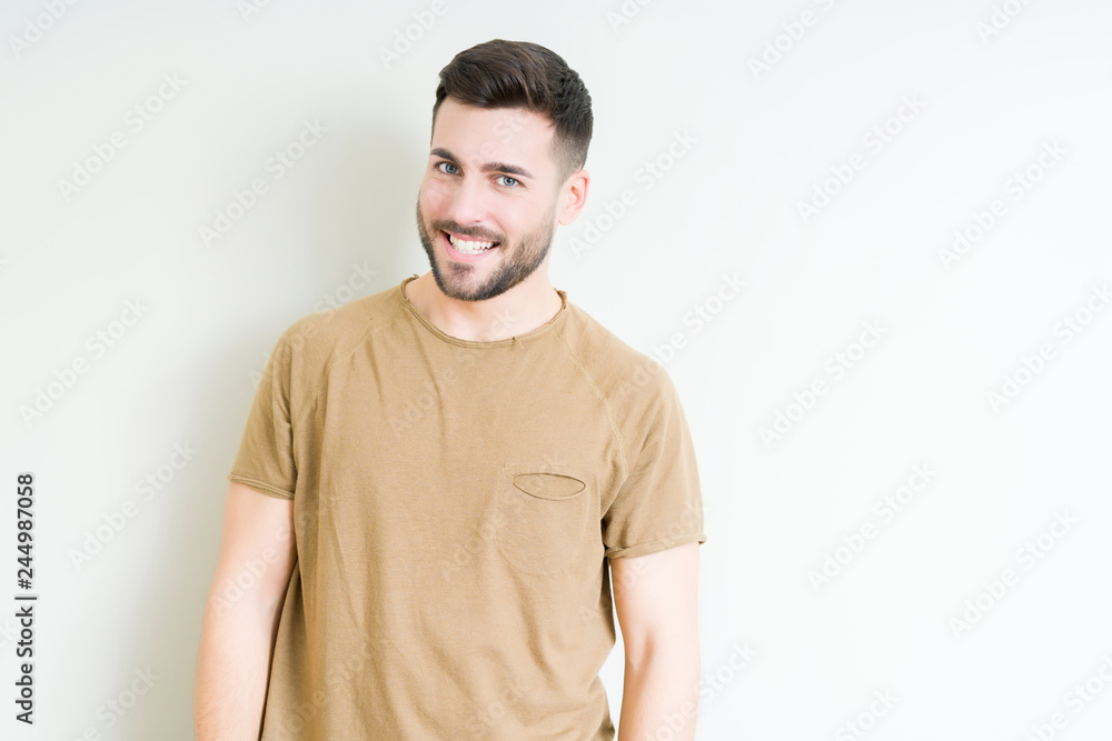 Young handsome man over isolated background looking away to side with smile on face, natural expression. Laughing confident. Young handsome man over isolated background looking away to side with smile on face, natural expression. Laughing confident.