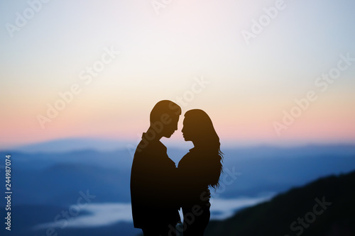 black silhouette couple lover hug together at outdoor background scene in valentine's day and romance moment	 photo