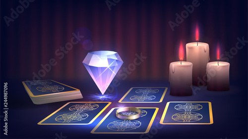 Tarot, candle, ring and magic cristall on the fortune-teller's table, prediction of the future, dark magic photo