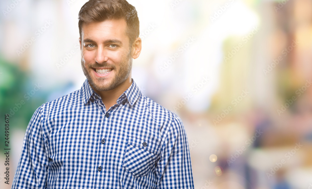 Young handsome man over isolated background looking away to side with smile on face, natural expression. Laughing confident. Young handsome man over isolated background looking away to side with smile on face, natural expression. Laughing confident.