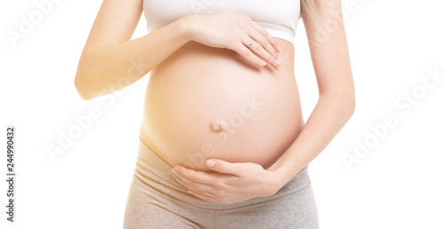 Close-up of pregnant woman touching her belly