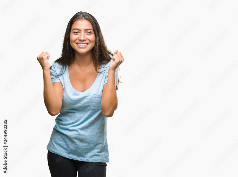 Young beautiful arab woman over isolated background celebrating surprised and amazed for success with arms raised and open eyes. Winner concept. Young beautiful arab woman over isolated background celebrating surprised and amazed for success with arms raised and open eyes. Winner concept.