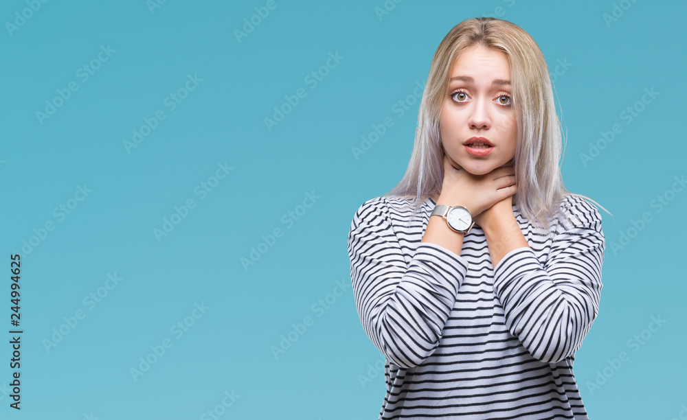 Young blonde woman over isolated background shouting and suffocate because painful strangle. Health problem. Asphyxiate and suicide concept. Young blonde woman over isolated background shouting and suffocate because painful strangle. Health problem. Asphyxiate and suicide concept.