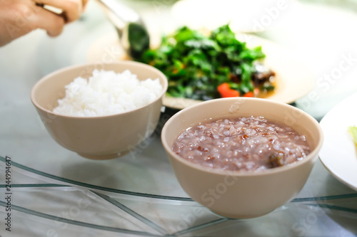 Asian rice porridge or soft boiled rice (white and brown rice) photo