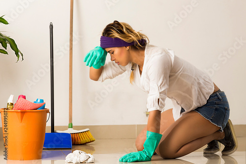 Young wife tired of grooming the floor. House work concept