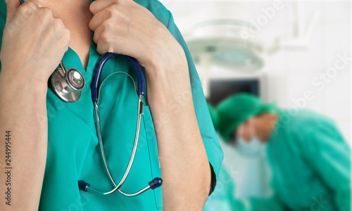 Close-up of a Smiling Nurse / Doctor Standing in an Operating