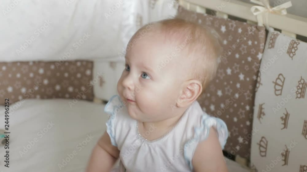 Funny Baby girl laughing in crib