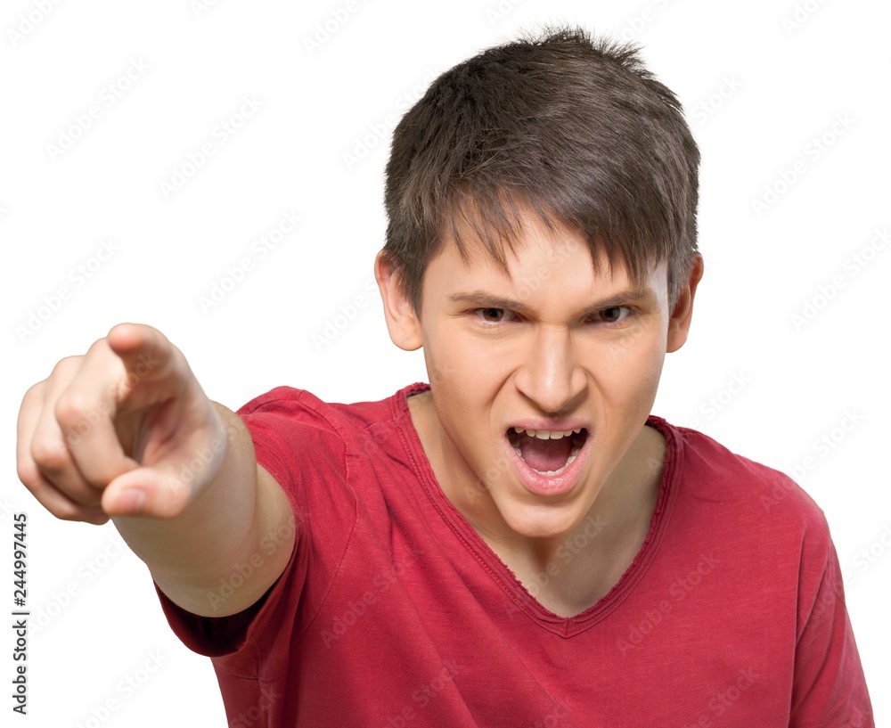Young man pointing angrily Young man pointing angrily