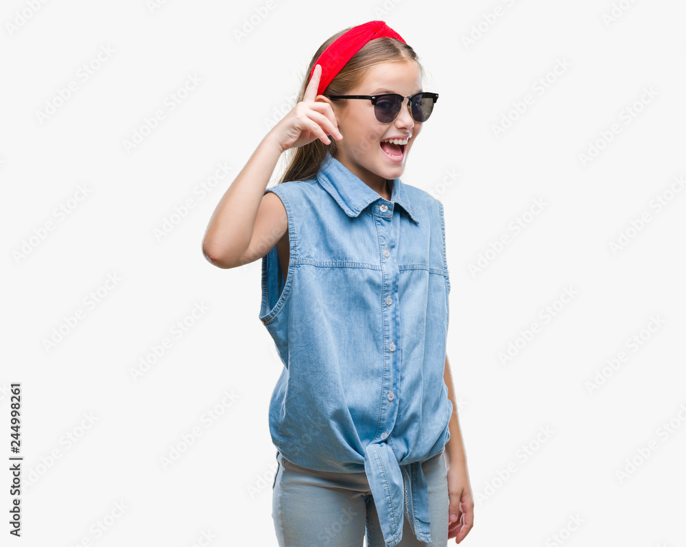 Young beautiful girl wearing sunglasses over isolated background pointing finger up with successful idea. Exited and happy. Number one. Young beautiful girl wearing sunglasses over isolated background pointing finger up with successful idea. Exited and happy. Number one.