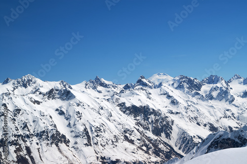 Snow covered mountains with mount Elbrus at background