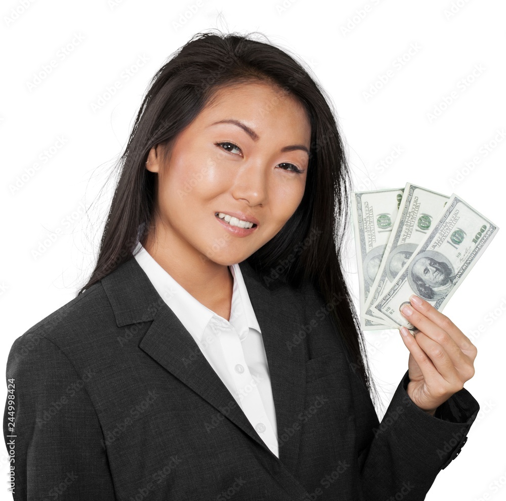 Friendly Asian Businesswoman Holding Money - Isolated Friendly Asian Businesswoman Holding Money - Isolated