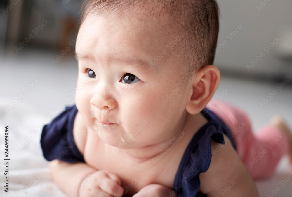 Closeup Asian baby who is practicing looking up Closeup Asian baby who is practicing looking up