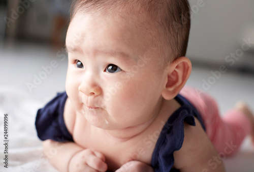 Closeup Asian baby who is practicing looking up