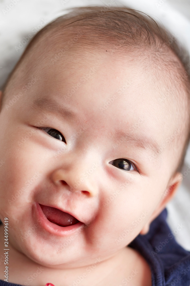 Closeup Asian baby's head expression Closeup Asian baby's head expression