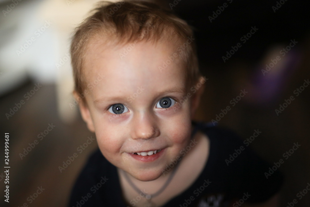 smiling Toddler boy, closeup portrait on dark smiling Toddler boy, closeup portrait on dark