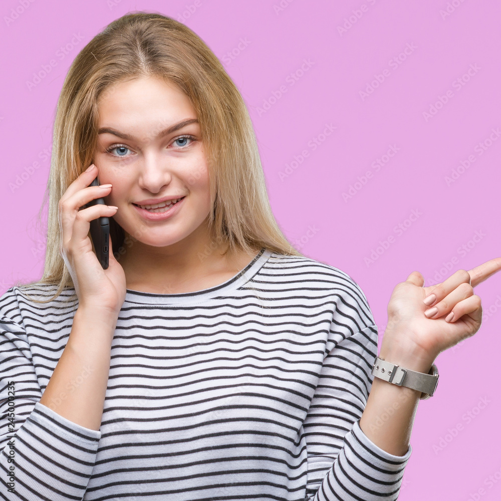 Young caucasian woman showing smartphone screen over isolated background very happy pointing with hand and finger to the side Young caucasian woman showing smartphone screen over isolated background very happy pointing with hand and finger to the side