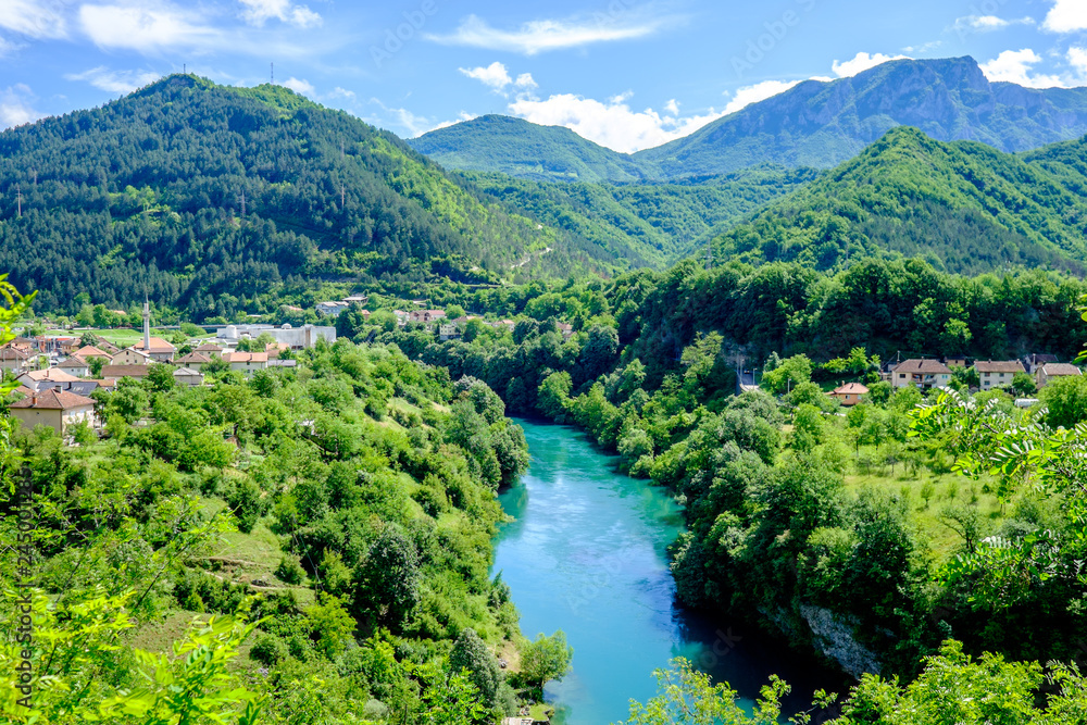 Azure brook flowing through the verdant countryside of Bosnia and Herzegovina Azure brook flowing through the verdant countryside of Bosnia and Herzegovina