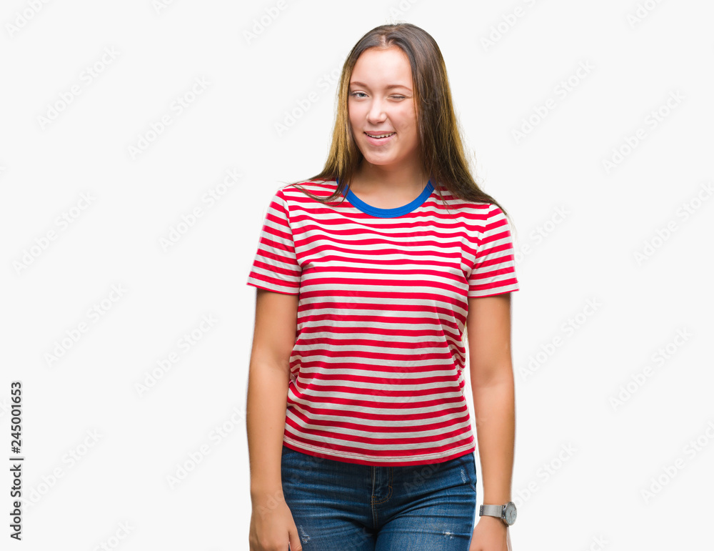 Young caucasian beautiful woman over isolated background winking looking at the camera with sexy expression, cheerful and happy face. Young caucasian beautiful woman over isolated background winking looking at the camera with sexy expression, cheerful and happy face.