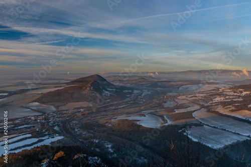 Sunrise on Boren hill near Bilina town in winter frosty morning