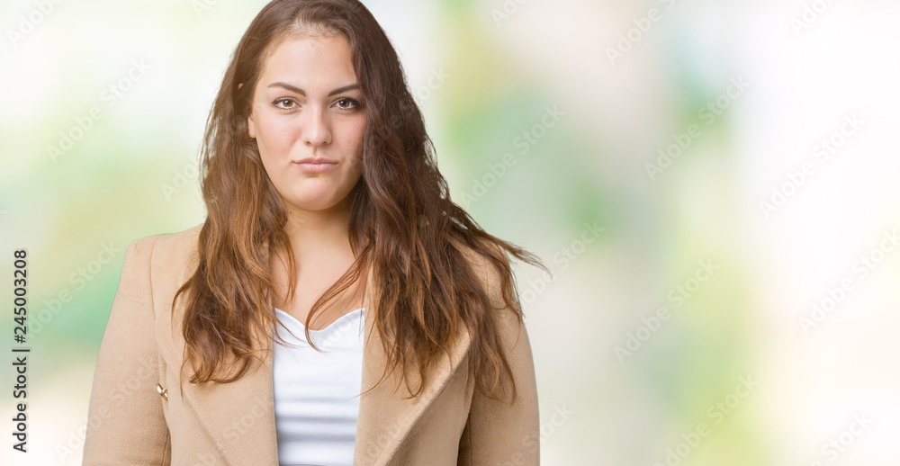 Beautiful plus size young woman wearing winter coat over isolated background depressed and worry for distress, crying angry and afraid. Sad expression.