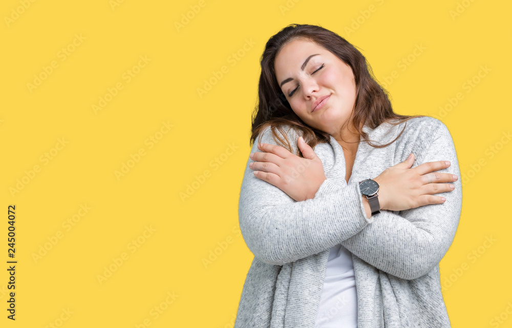 Beautiful plus size young woman wearing winter jacket over isolated background Hugging oneself happy and positive, smiling confident. Self love and self care Beautiful plus size young woman wearing winter jacket over isolated background Hugging oneself happy and positive, smiling confident. Self love and self care