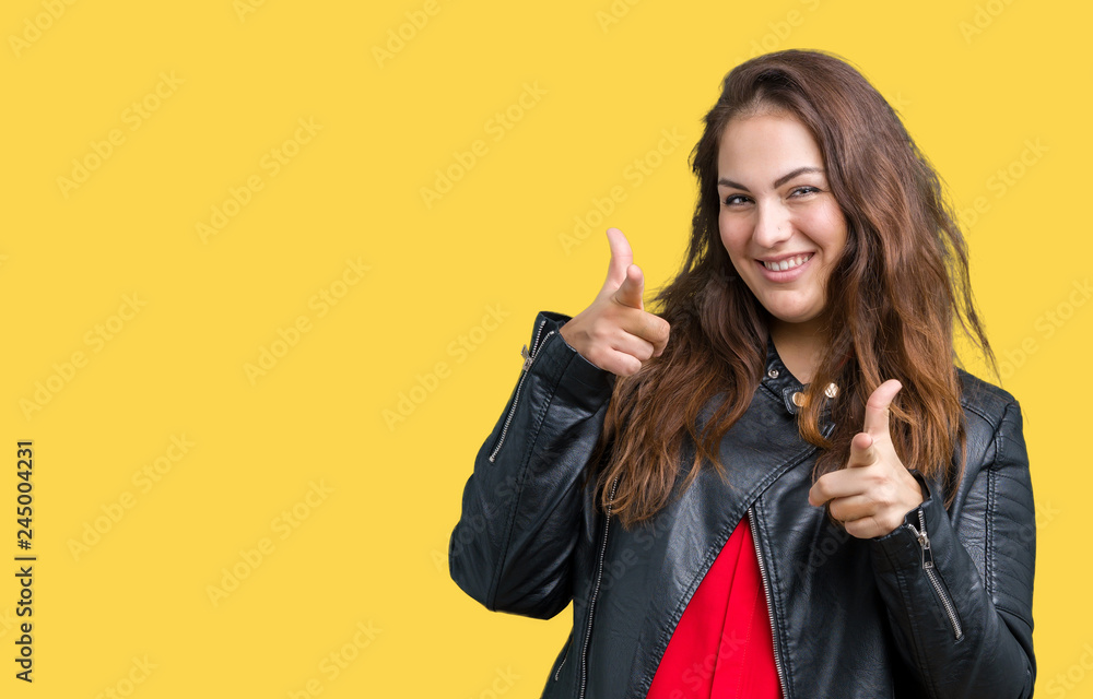 Beautiful plus size young woman wearing a fashion leather jacket over isolated background pointing fingers to camera with happy and funny face. Good energy and vibes. Beautiful plus size young woman wearing a fashion leather jacket over isolated background pointing fingers to camera with happy and funny face. Good energy and vibes.