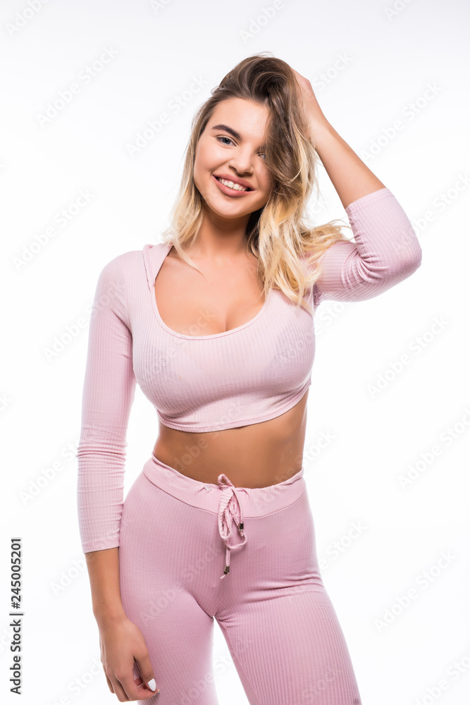 Portrait of sexy young woman ready wearing for workout on grey background