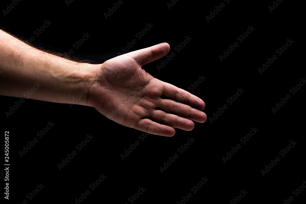 Isolated men hand with black background Isolated men hand with black background