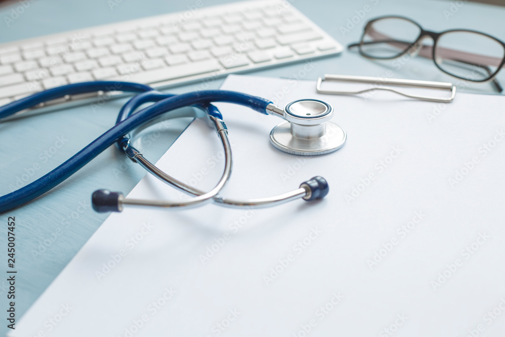 Stethoscope and medical attributes on the table at the doctor. Stethoscope and medical attributes on the table at the doctor.