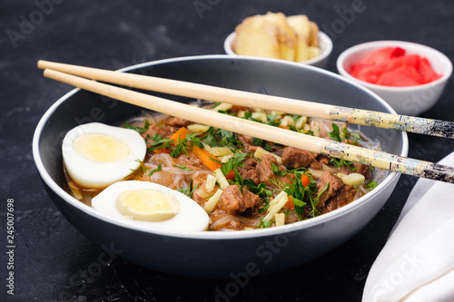 Home food Asia, Vietnam, egg noodle soup, colorful food ingredient for this food such as egg, beef, broth, ginger, soy sauce, carrot, vegetable