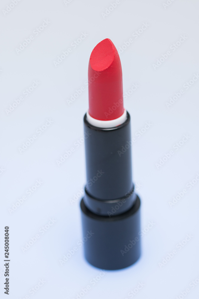 Shiny new red or scarlet lipstick over white Shiny new red or scarlet lipstick over white