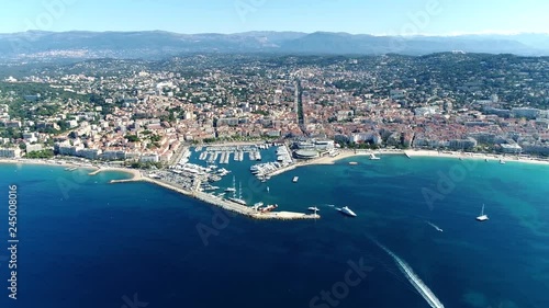 High altitude aerial shot from helicopter showing Cannes a city located on  French Riviera and host of annual Film Festival and known for its association with rich and famous 4k high resolution photo