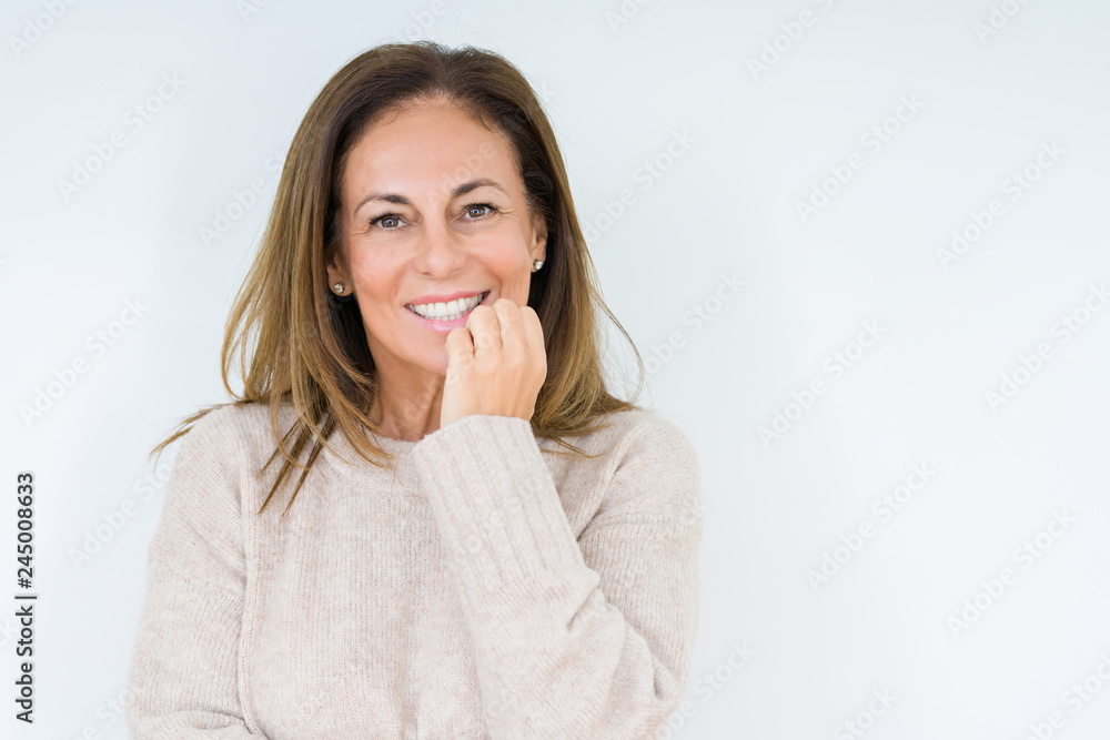 Beautiful middle age woman over isolated background looking stressed and nervous with hands on mouth biting nails. Anxiety problem. Beautiful middle age woman over isolated background looking stressed and nervous with hands on mouth biting nails. Anxiety problem.