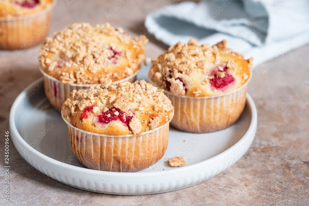 Fresh homemade delicious raspberry muffins on a table Fresh homemade delicious raspberry muffins on a table