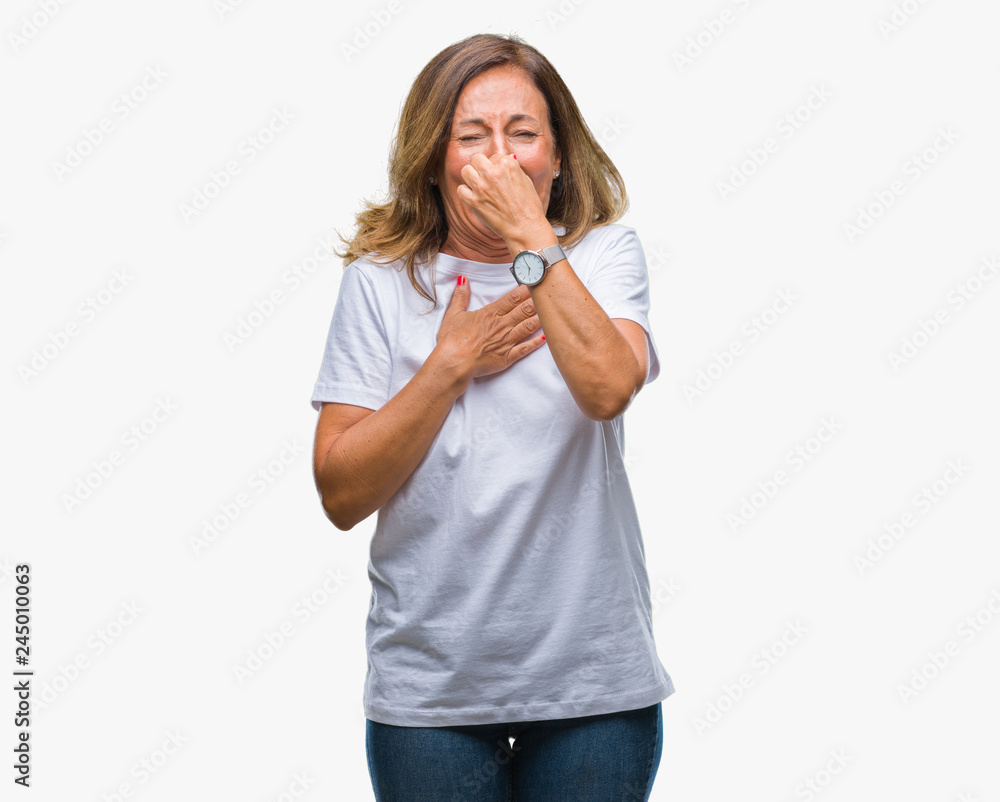 Middle age senior hispanic woman over isolated background smelling something stinky and disgusting, intolerable smell, holding breath with fingers on nose. Bad smells concept. Middle age senior hispanic woman over isolated background smelling something stinky and disgusting, intolerable smell, holding breath with fingers on nose. Bad smells concept.