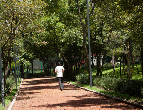  The track located in the forest of Mexico City welcomes athletes, like the man walking on the track, expected to clean their lungs in the lungs of the city for a healthy lifestyle. © Amalia