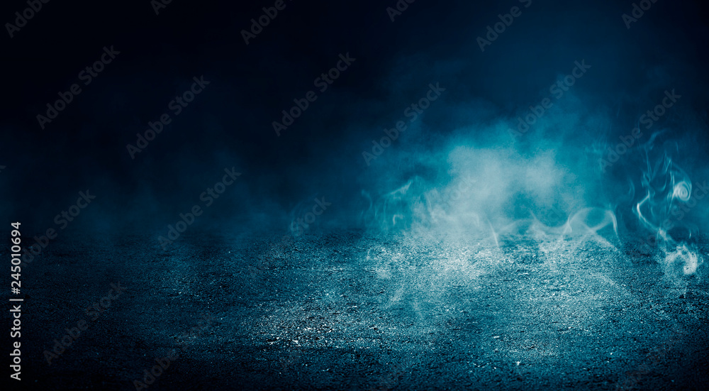 Black background of empty street, room, blue searchlight illuminates asphalt, smoke