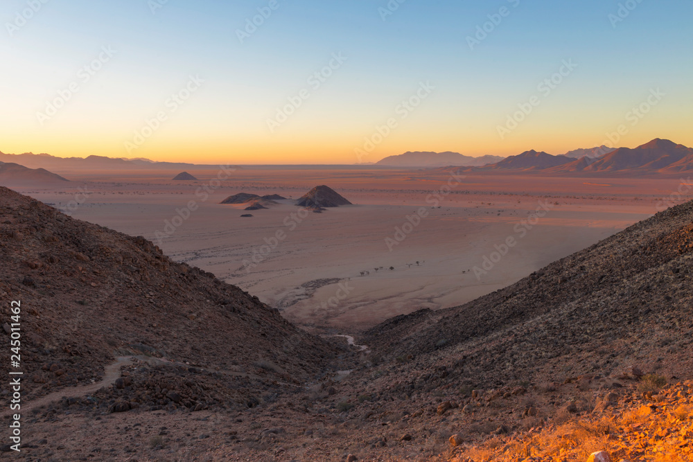 View from mountain on desert plane