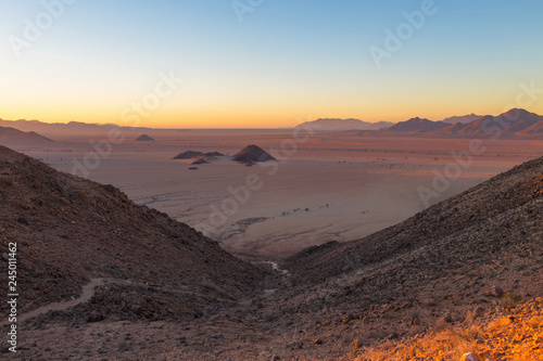 View from mountain on desert plane