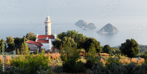 Picturesque scene with lighthouse on Gelidonya cape and small islands in Mediterranean sea. Landscape photography
