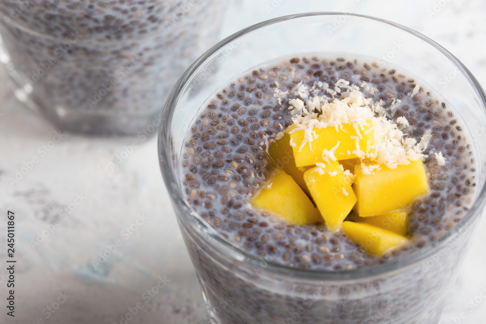 Mango chia pudding with almond milk in glasses, healthy breakfast meal Mango chia pudding with almond milk in glasses, healthy breakfast meal