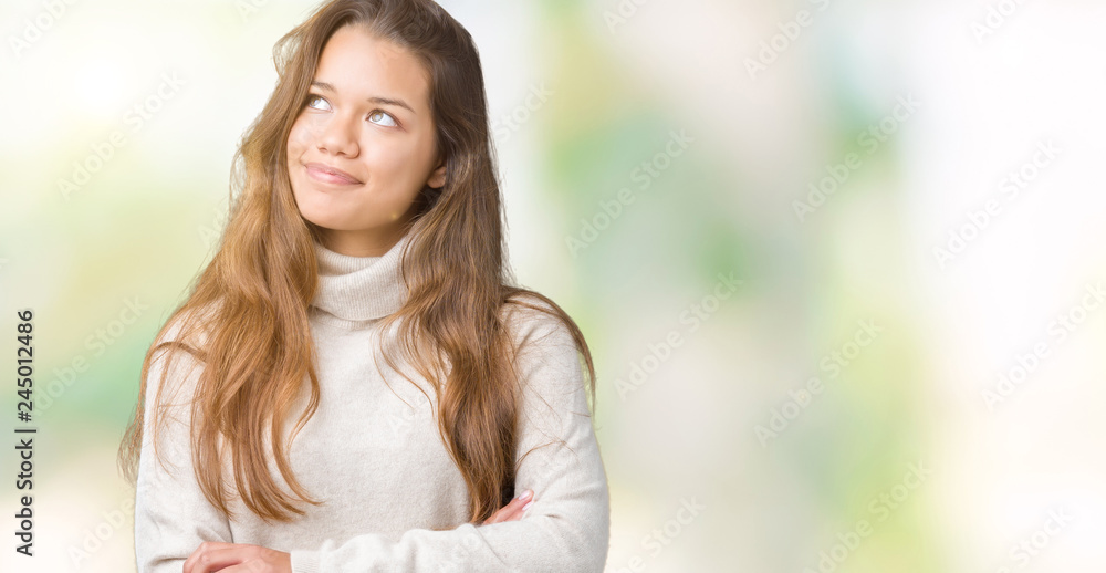 Young beautiful brunette woman wearing turtleneck sweater over isolated background smiling looking side and staring away thinking. Young beautiful brunette woman wearing turtleneck sweater over isolated background smiling looking side and staring away thinking.